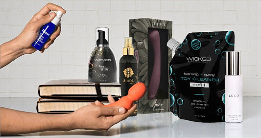 a bottle of intimate toy cleaner in the background. It symbolizes a hygiene and care routine.