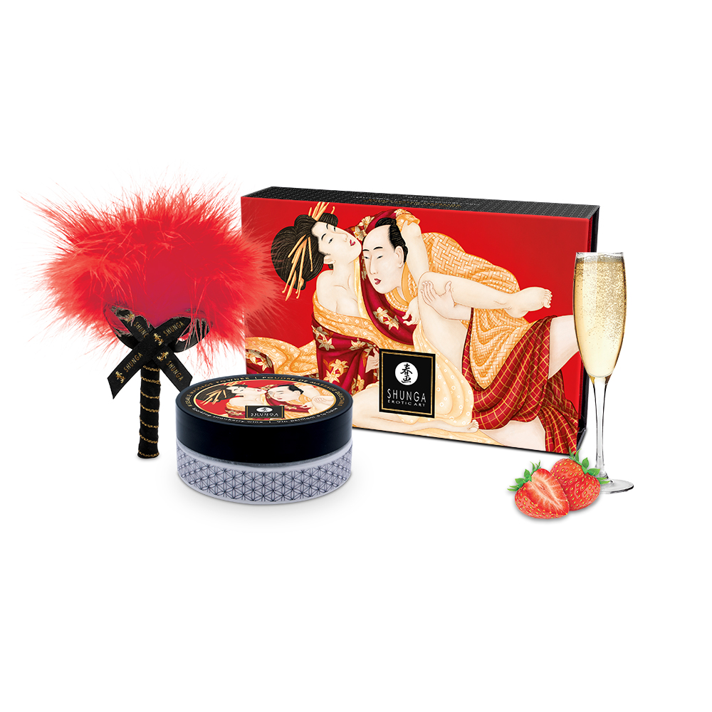 Sweet Snow Body Powder - Sparkling Strawberry Wine, candle, box with artistic design, glass of champagne, and strawberries on a white background.