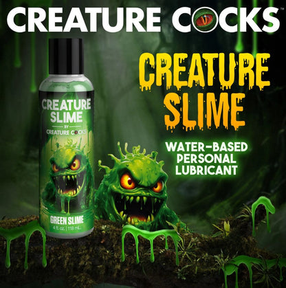 Bottle of 'Creature Cocks Creature Slime - Green H2O Lube 4oz' water-based personal lubricant with a green monster figure on a dark background.