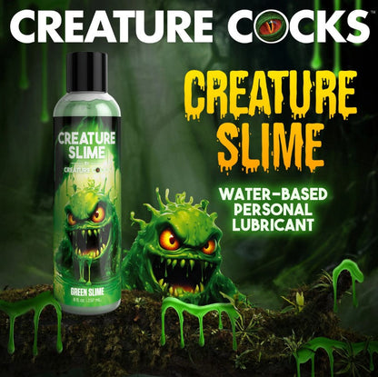 Bottle of 'Creature Cocks Creature Slime - Green H2O Lube 8oz' water-based personal lubricant with a green monster figure on a dark background.